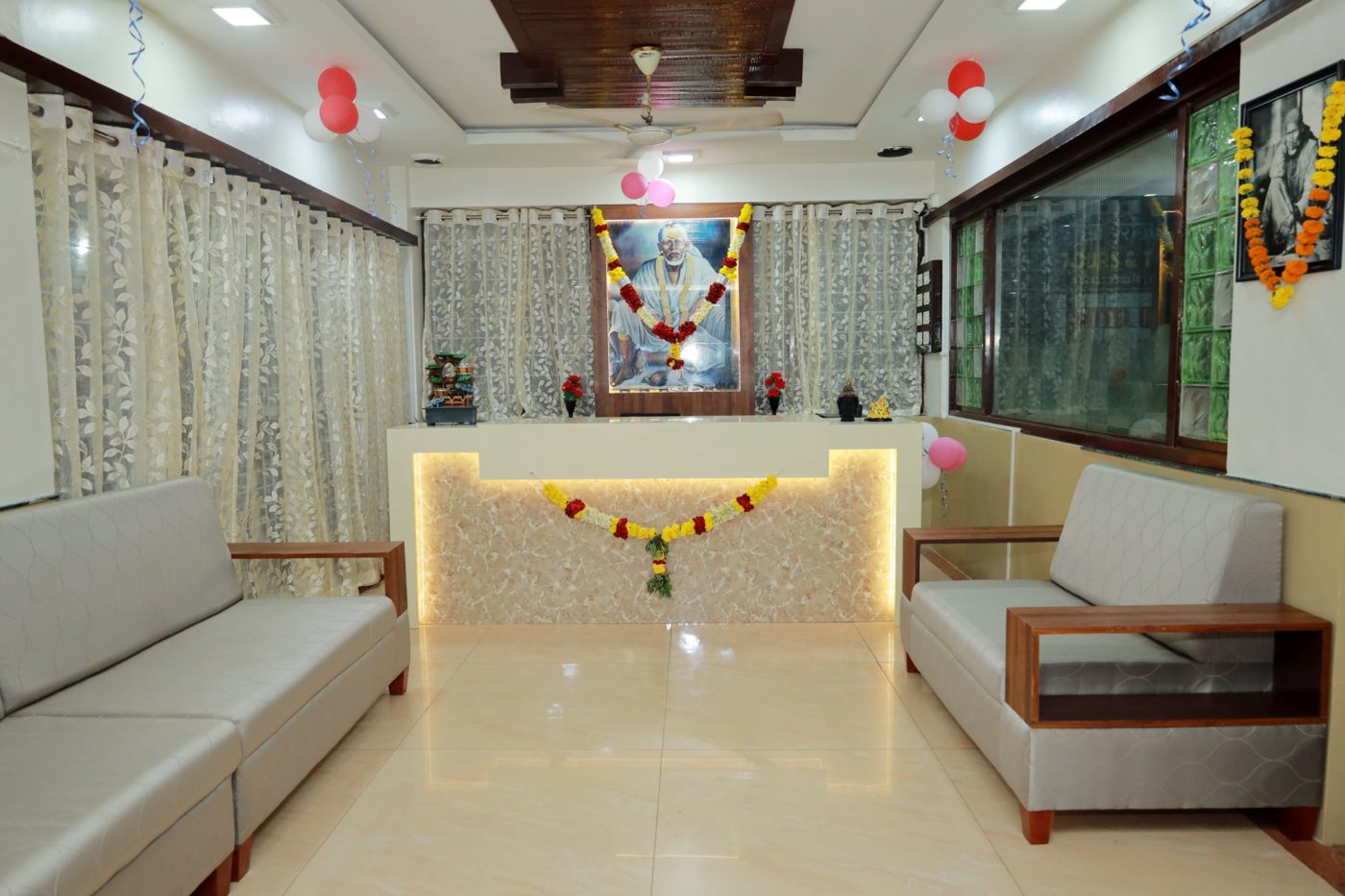 Reception desk, with Shri Saibaba's portrait